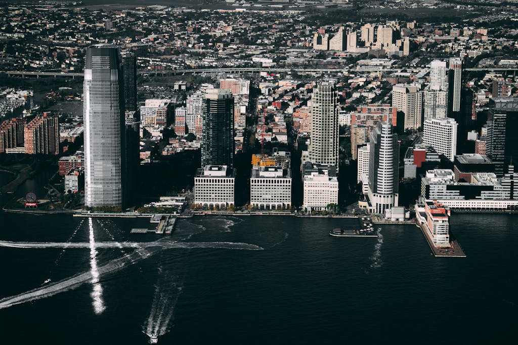 Dramatic aerial view of the Jersey City skyline showcasing prominent skyscrapers along the Hudson River.
