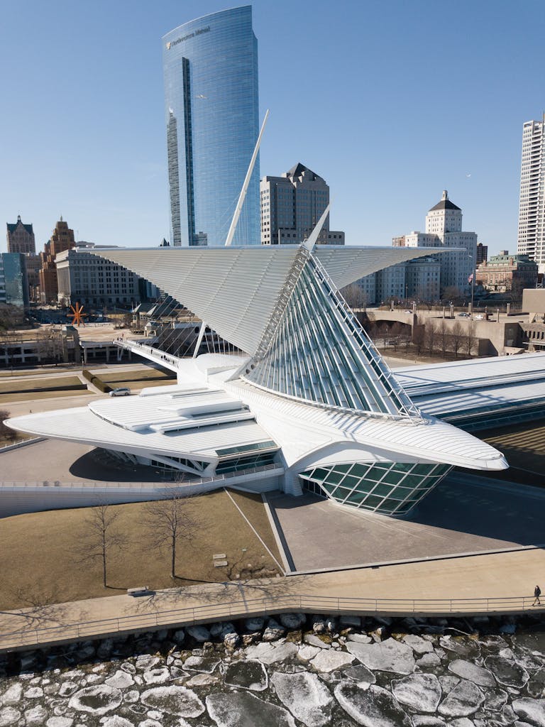 A stunning aerial view of Milwaukee Art Museum with modern city skyline.