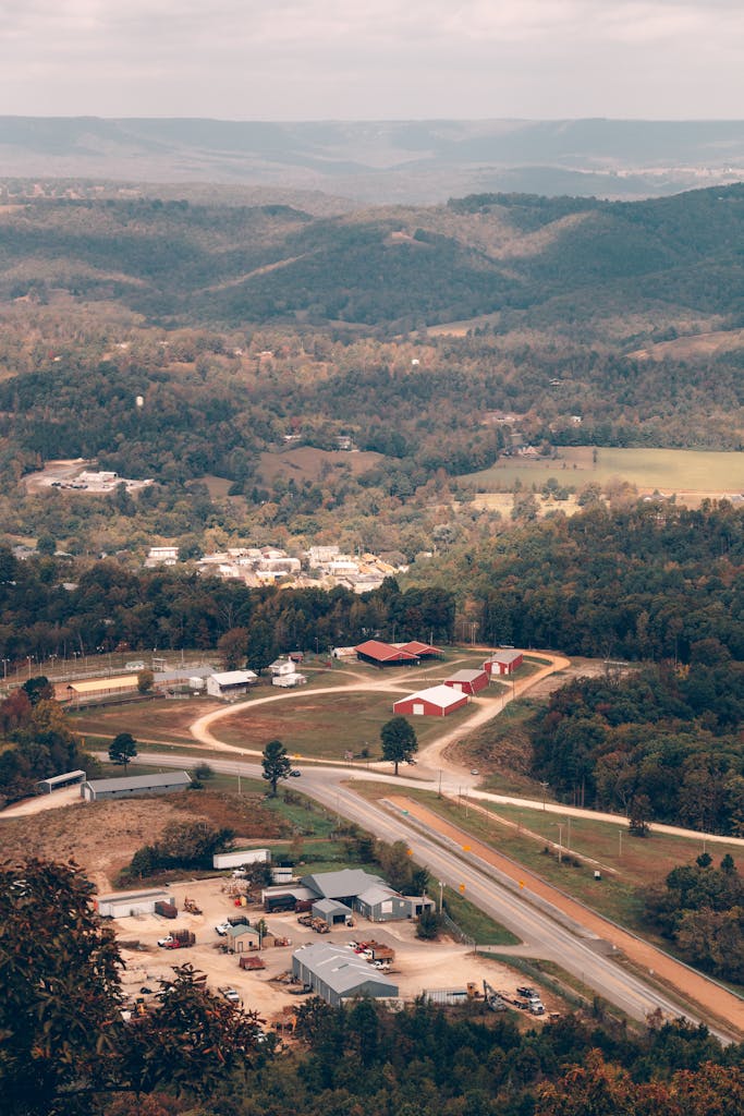 Discover the scenic hills and countryside of Arkansas captured from above during fall.